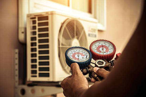 Professional Heat Pump Repair technician working in Tomball, TX